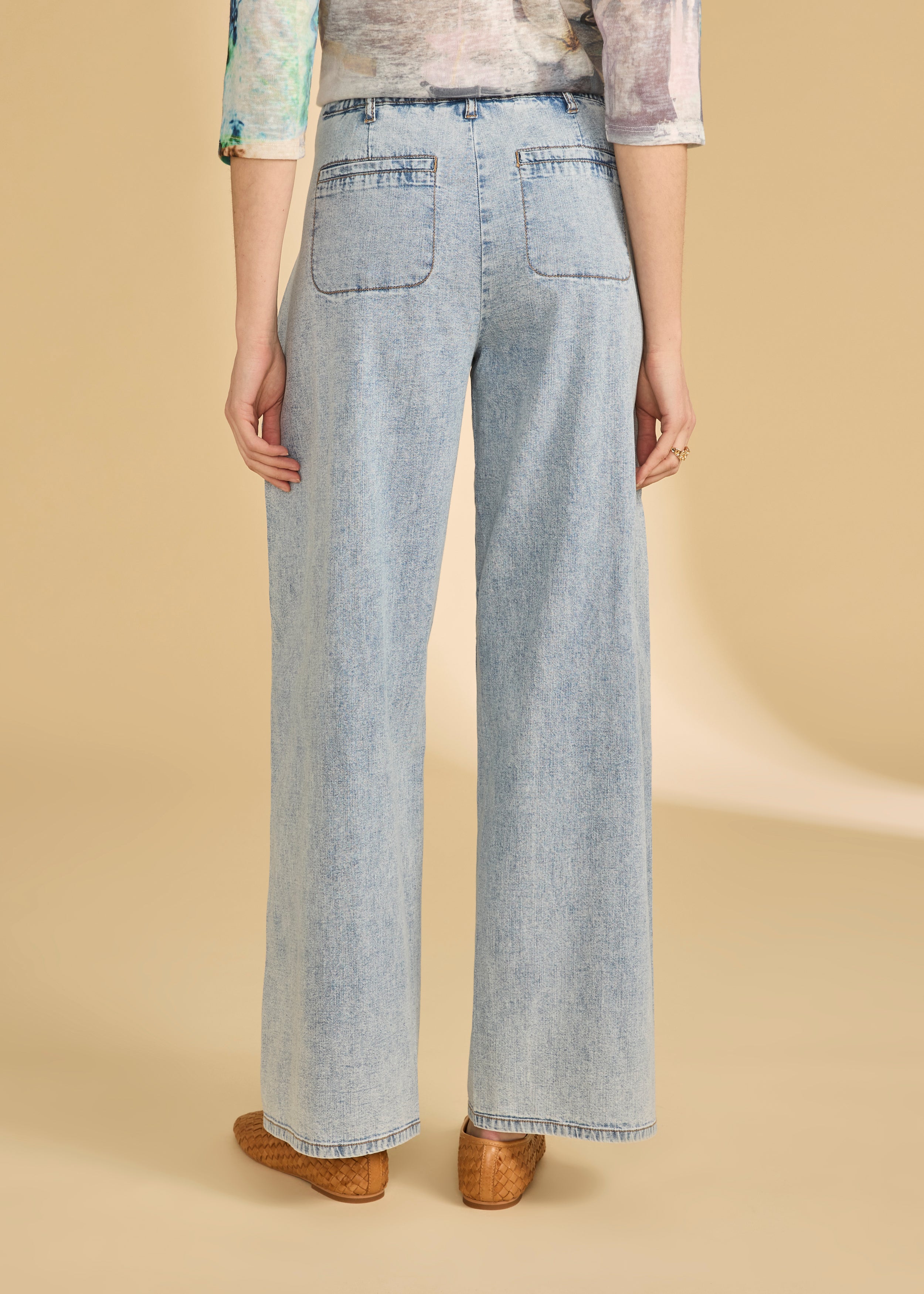 Back view of powder wash wide leg jeans highlighting back pockets by French Dressing Jeans (FDJ)