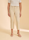 Close-up of cream pants highlighting high-rise design and slim fit by French Dressing Jeans (FDJ)
