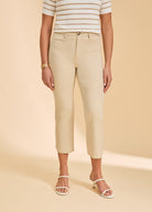 Close-up of cream pants highlighting high-rise design and slim fit by French Dressing Jeans (FDJ)