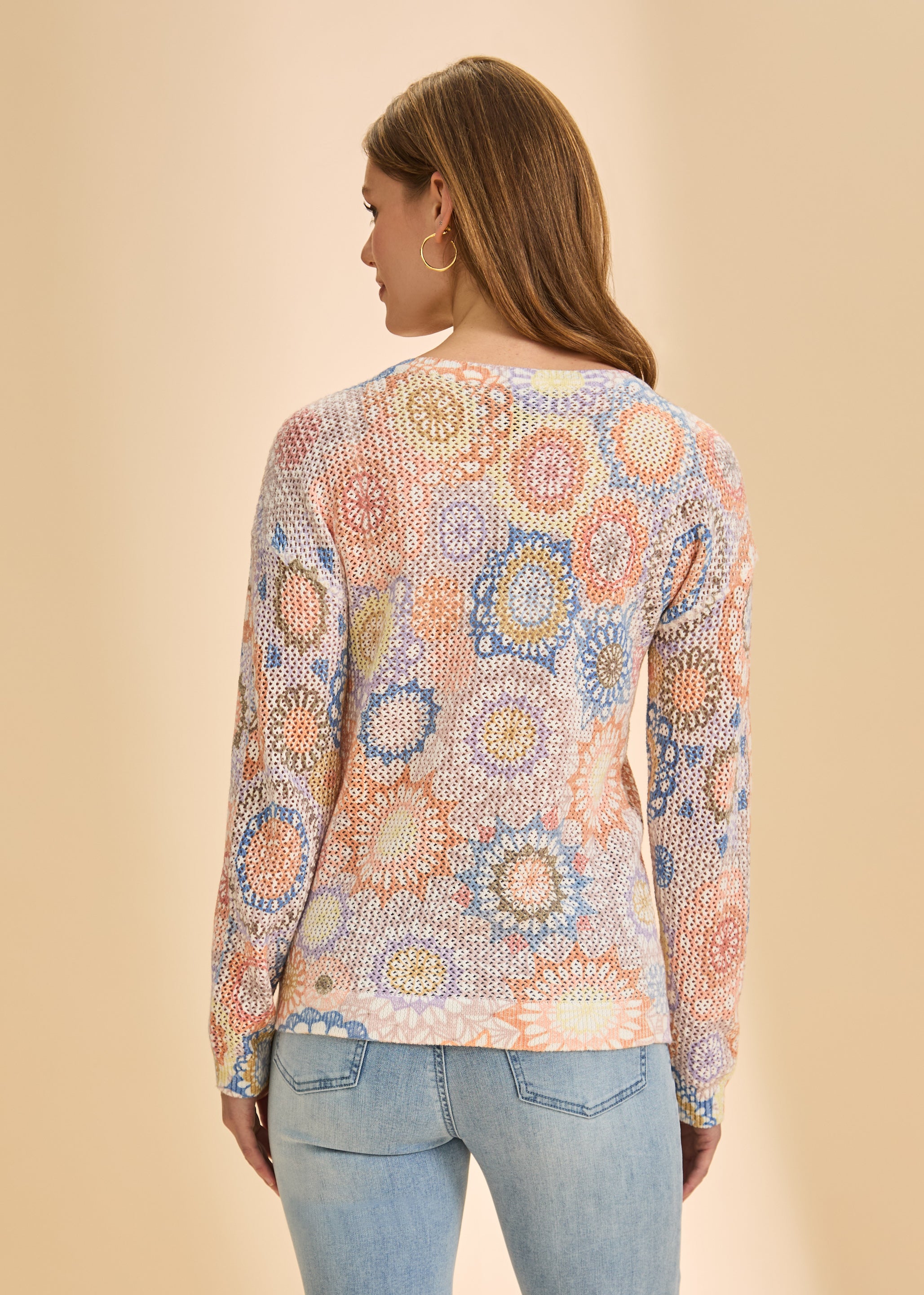 Back view of orange and blue mesh sweater displaying intricate pattern by French Dressing Jeans (FDJ)
