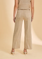 Beige wide-leg pants back view showing patch pockets by French Dressing Jeans (FDJ)