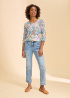 Full view of floral print sweater with embroidered jeans by French Dressing Jeans (FDJ)