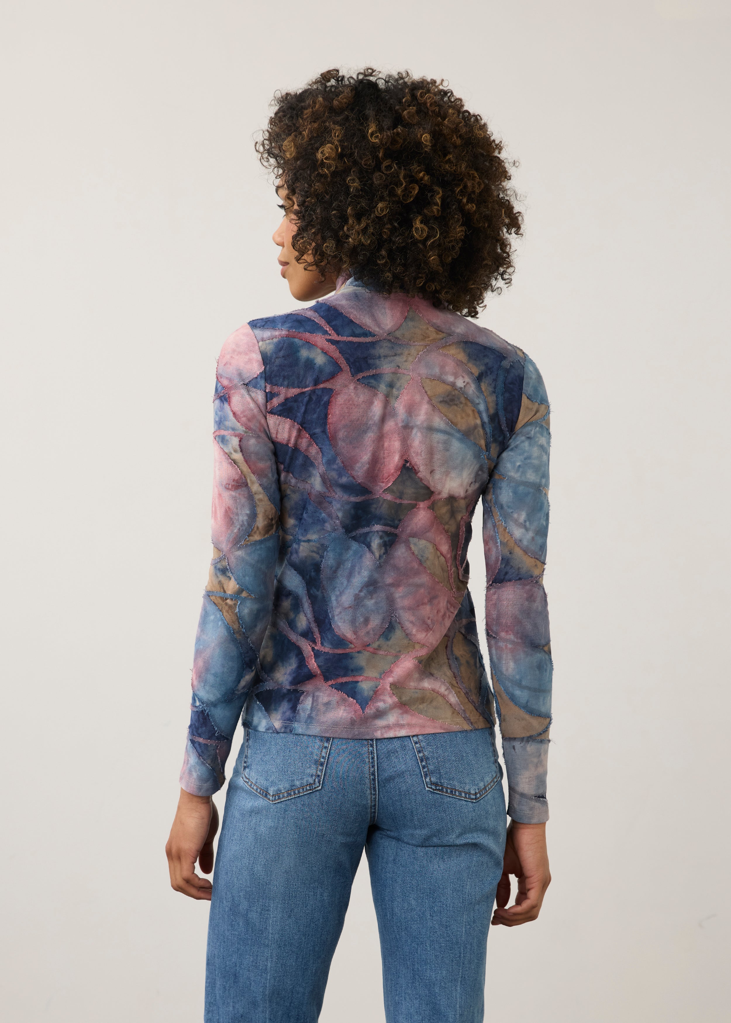 Back view of abstract blue and pink print top, highlighting seamless design by French Dressing Jeans (FDJ)