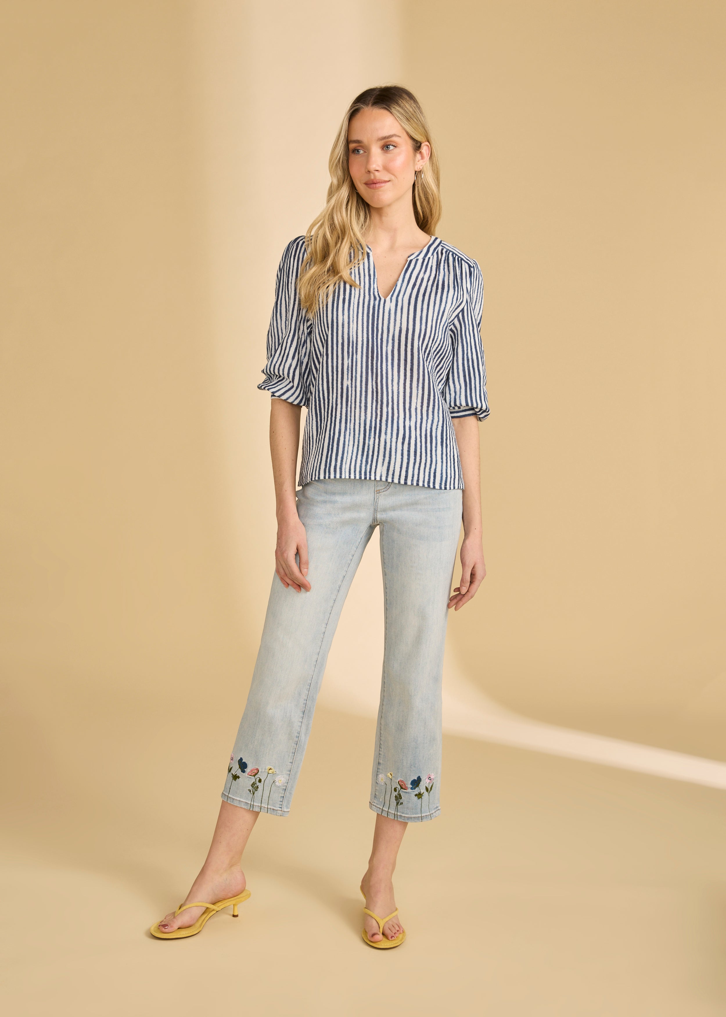 Full body view of navy striped blouse styled with jeans for a casual look by French Dressing Jeans (FDJ)