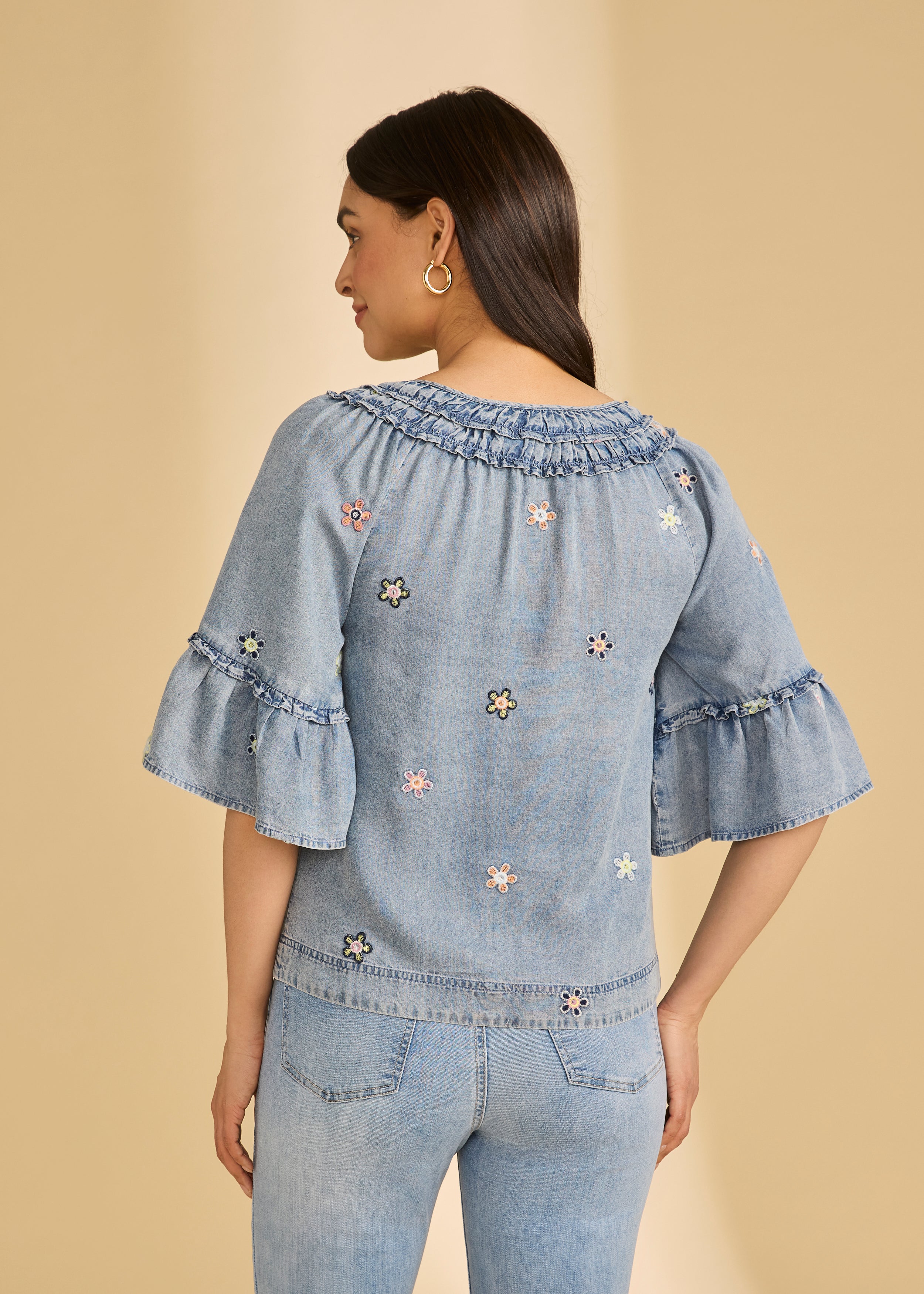 Back view of denim top with floral embroidery and flared sleeves by French Dressing Jeans (FDJ)