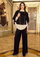 Black cropped jacket styled over striped blouse with wide-leg pants by French Dressing Jeans (FDJ)