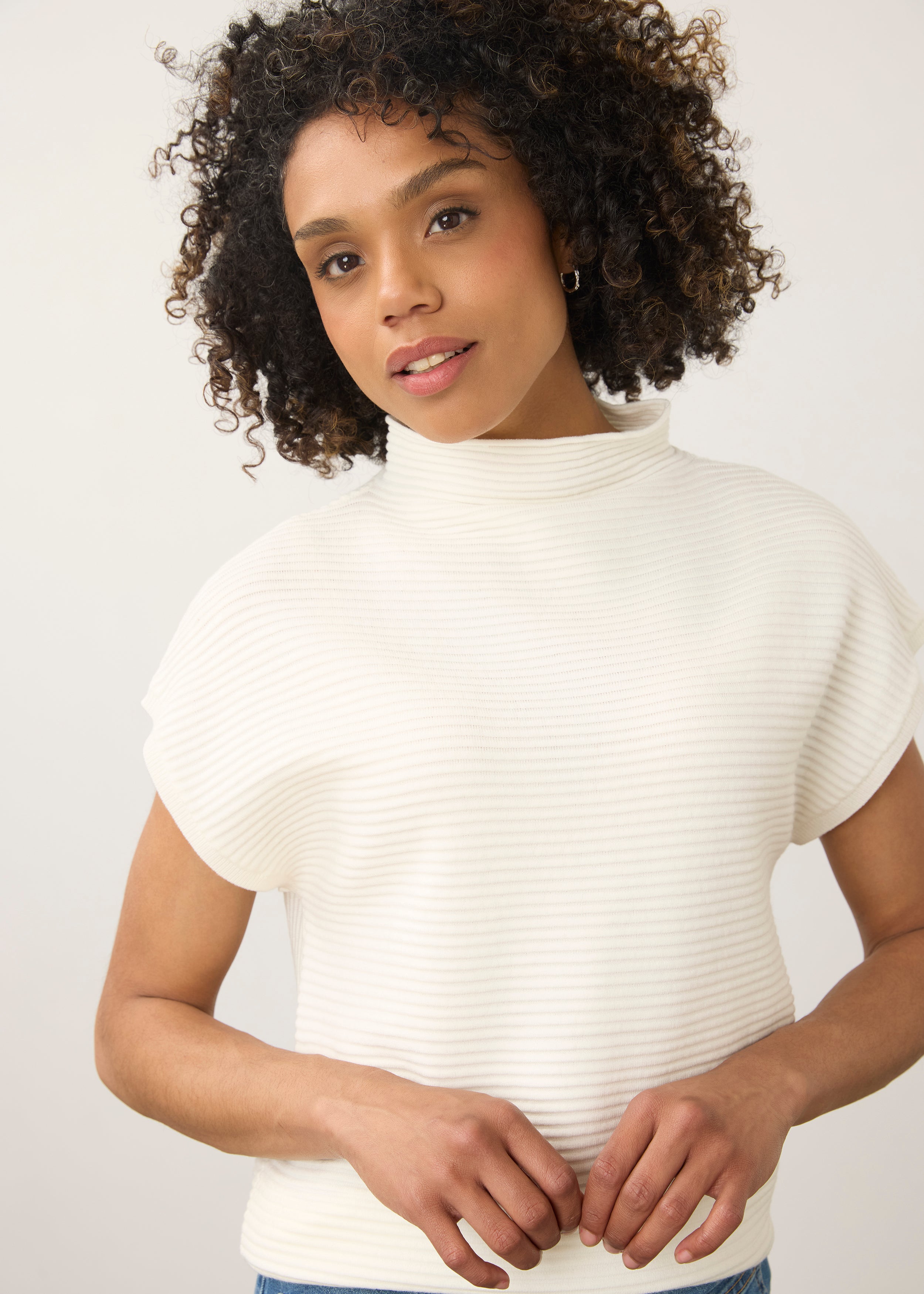 Close-up of white ribbed top showing high collar and short sleeves by French Dressing Jeans (FDJ)