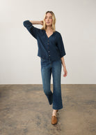 Model in navy blouse and jeans, full body view by French Dressing Jeans (FDJ)