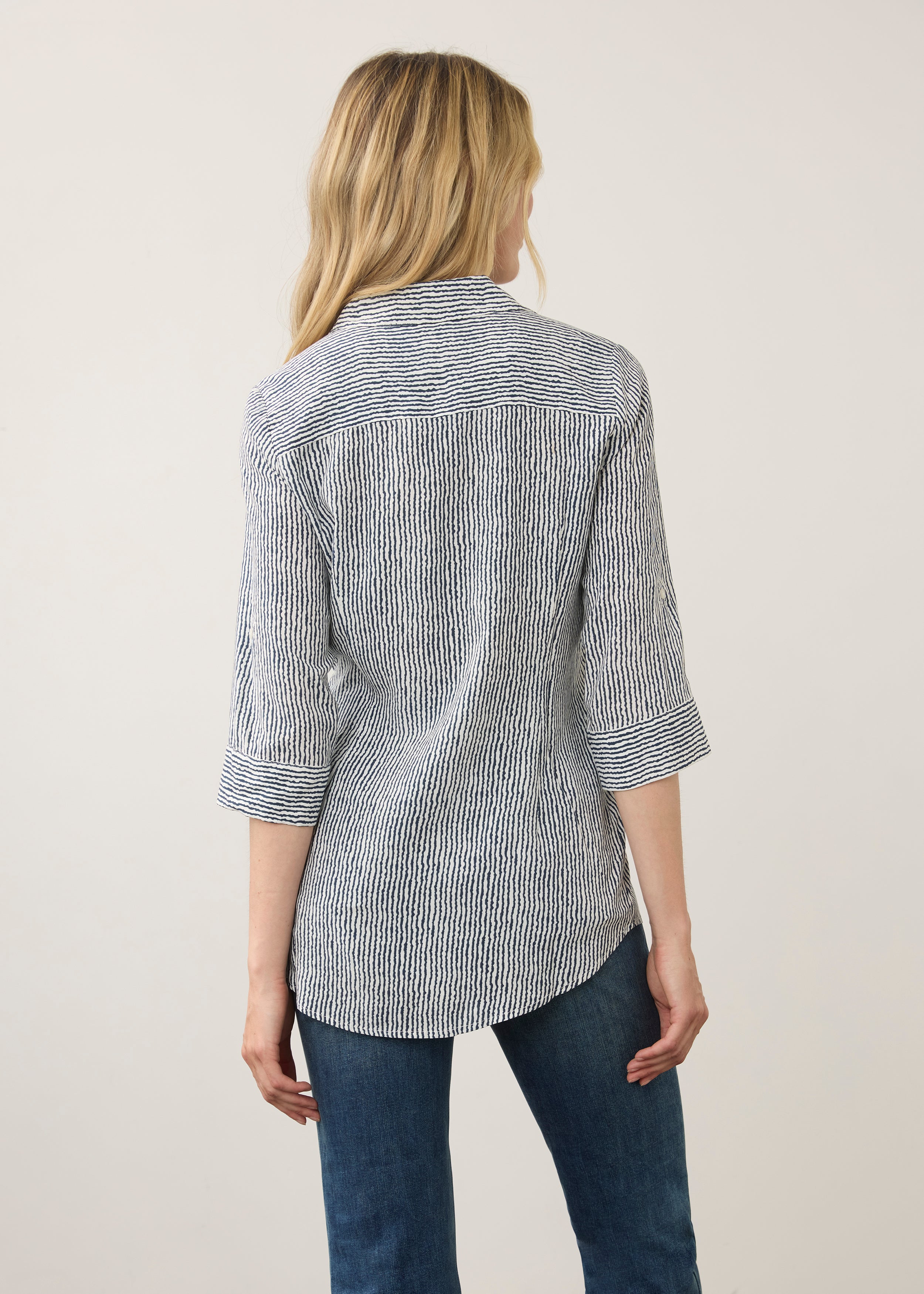 Back view of striped navy and white shirt showing long sleeves by French Dressing Jeans (FDJ)