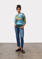 Full body view of blue abstract print top with jeans and loafers by French Dressing Jeans (FDJ)