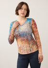 Front view of long sleeve V-neck top in vibrant gradient pattern by French Dressing Jeans (FDJ)