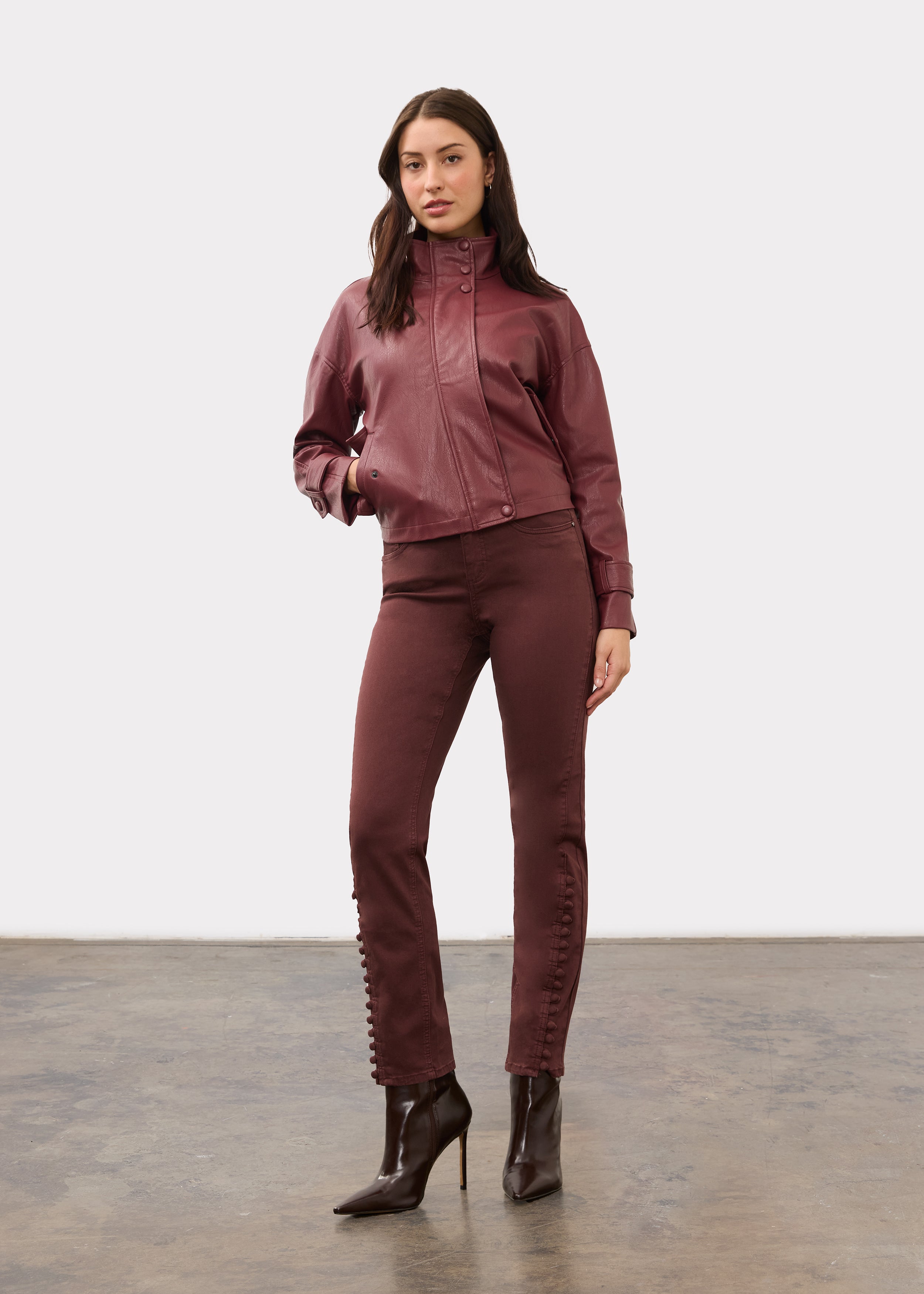 Full view of model in burgundy Olivia denim and jacket with boots by French Dressing Jeans (FDJ)