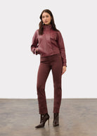 Full view of model in burgundy Olivia denim and jacket with boots by French Dressing Jeans (FDJ)