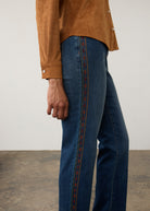 Side detail of medium blue jeans with decorative embroidery along the seam by French Dressing Jeans (FDJ) par French Dressing Jeans (FDJ)