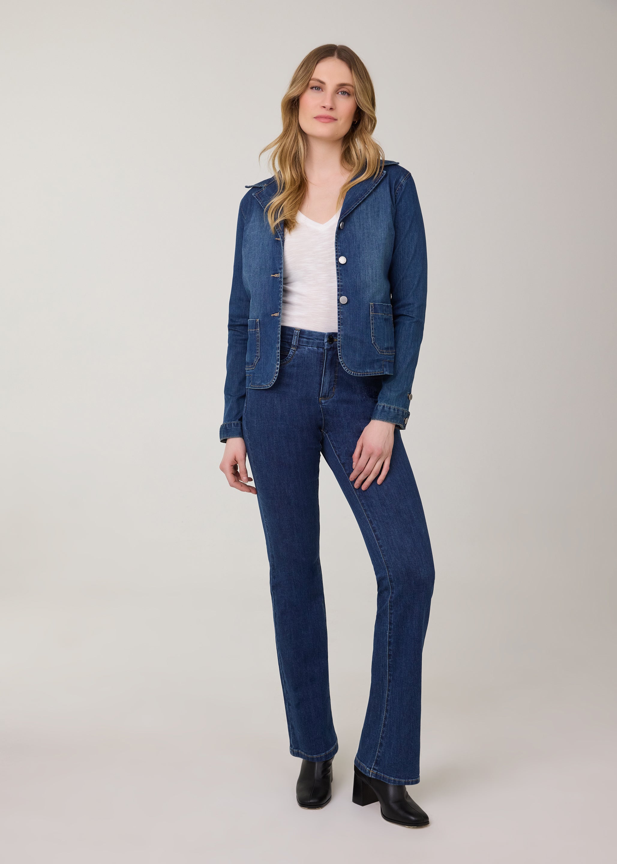 Model in bootcut denim jeans in dark Delight color by French Dressing Jeans (FDJ)