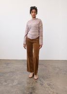 Full view of model in camel Olivia wide leg pants paired with a striped sweater by French Dressing Jeans (FDJ)