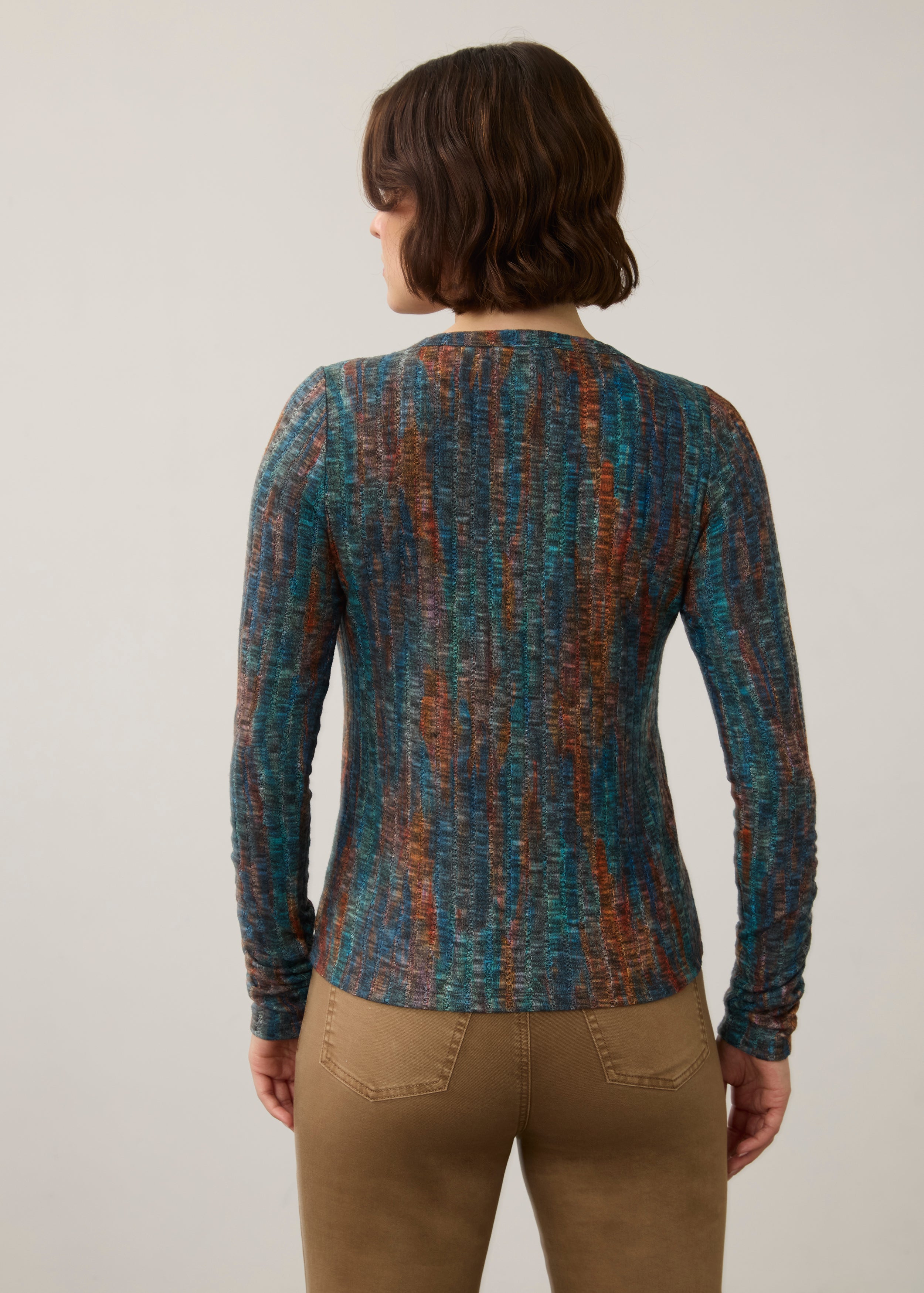 Back view of striped V-neck top, highlighting seamless design and earthy tones by French Dressing Jeans (FDJ)
