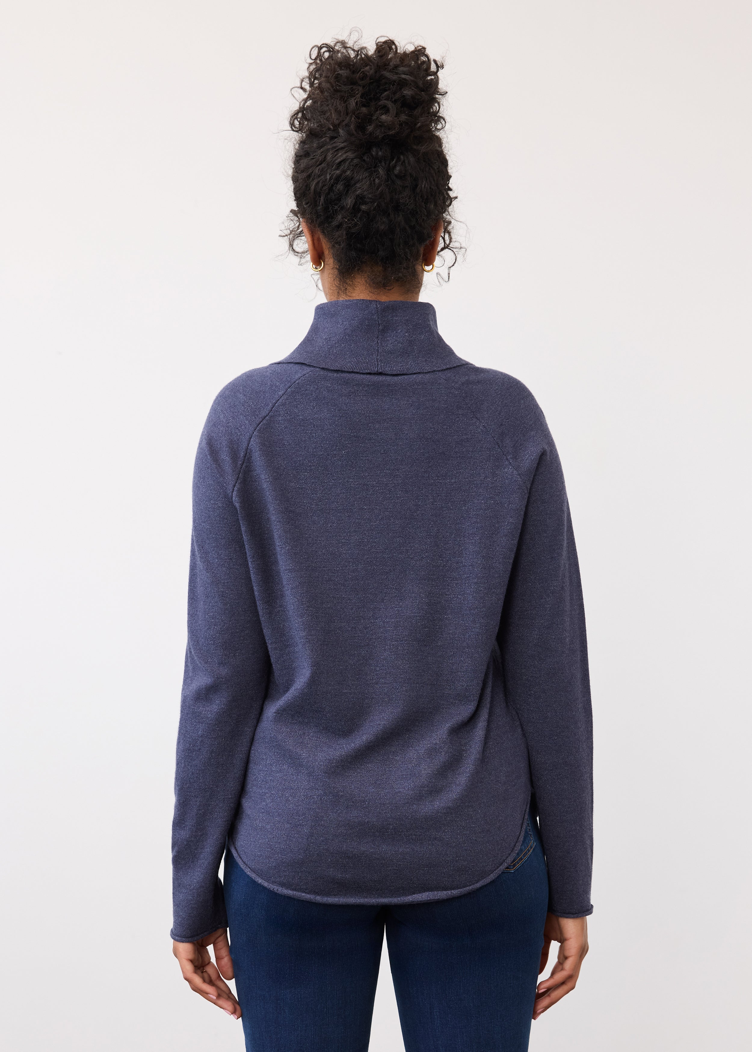 Back view of navy sweater highlighting rounded hemline by French Dressing Jeans (FDJ)