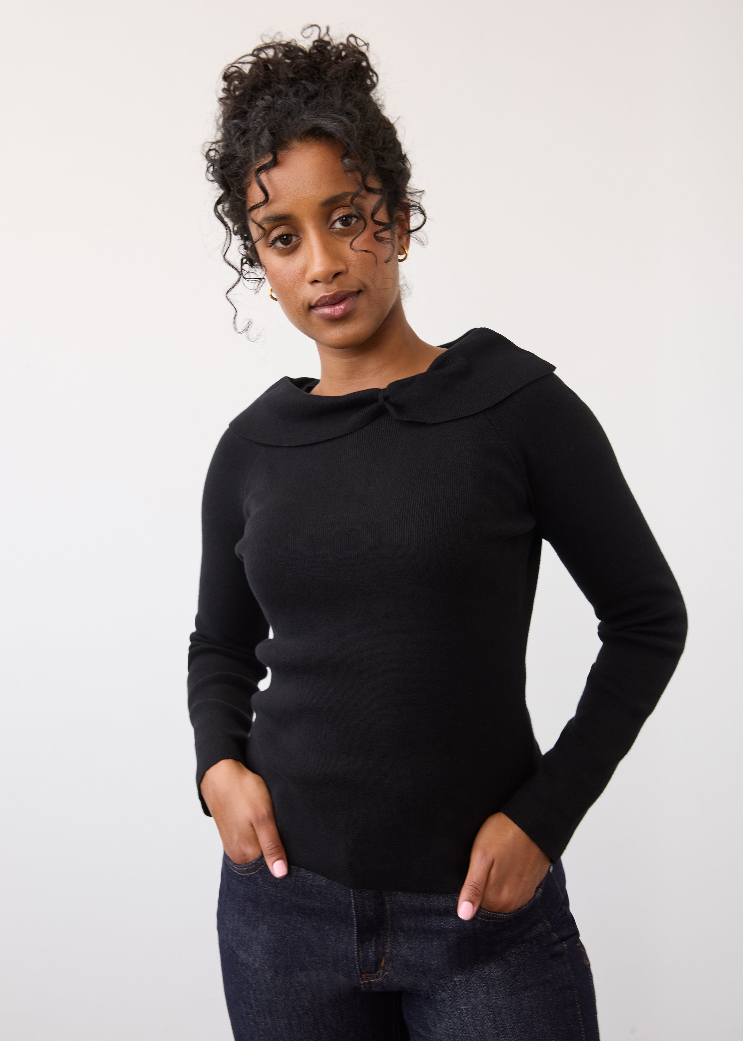 Front view of black off-the-shoulder sweater with long sleeves by French Dressing Jeans (FDJ)