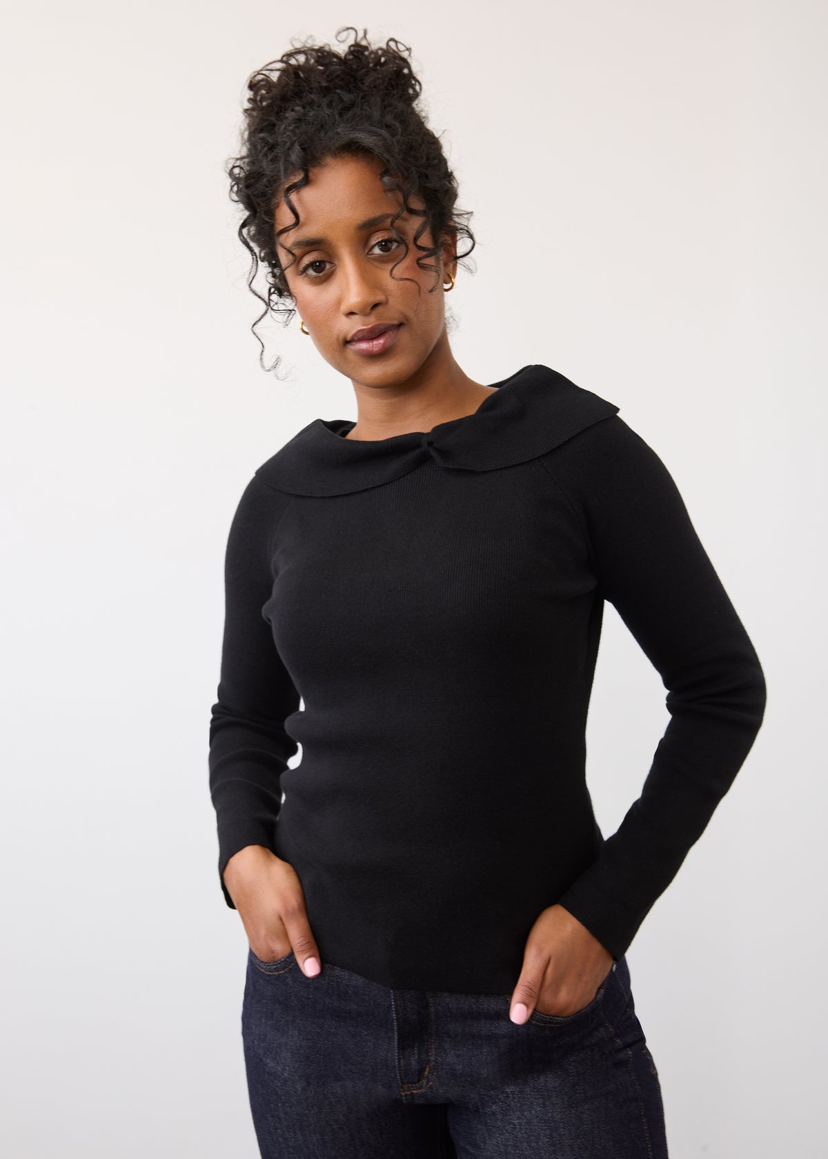 Front view of black off-the-shoulder sweater with long sleeves by French Dressing Jeans (FDJ)