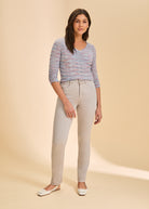 Full view of multicolor V-neck sweater styled with light pants by French Dressing Jeans (FDJ)