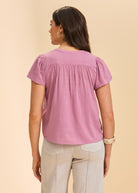 Back view of lavender short-sleeve top highlighting gathered yoke by French Dressing Jeans (FDJ)