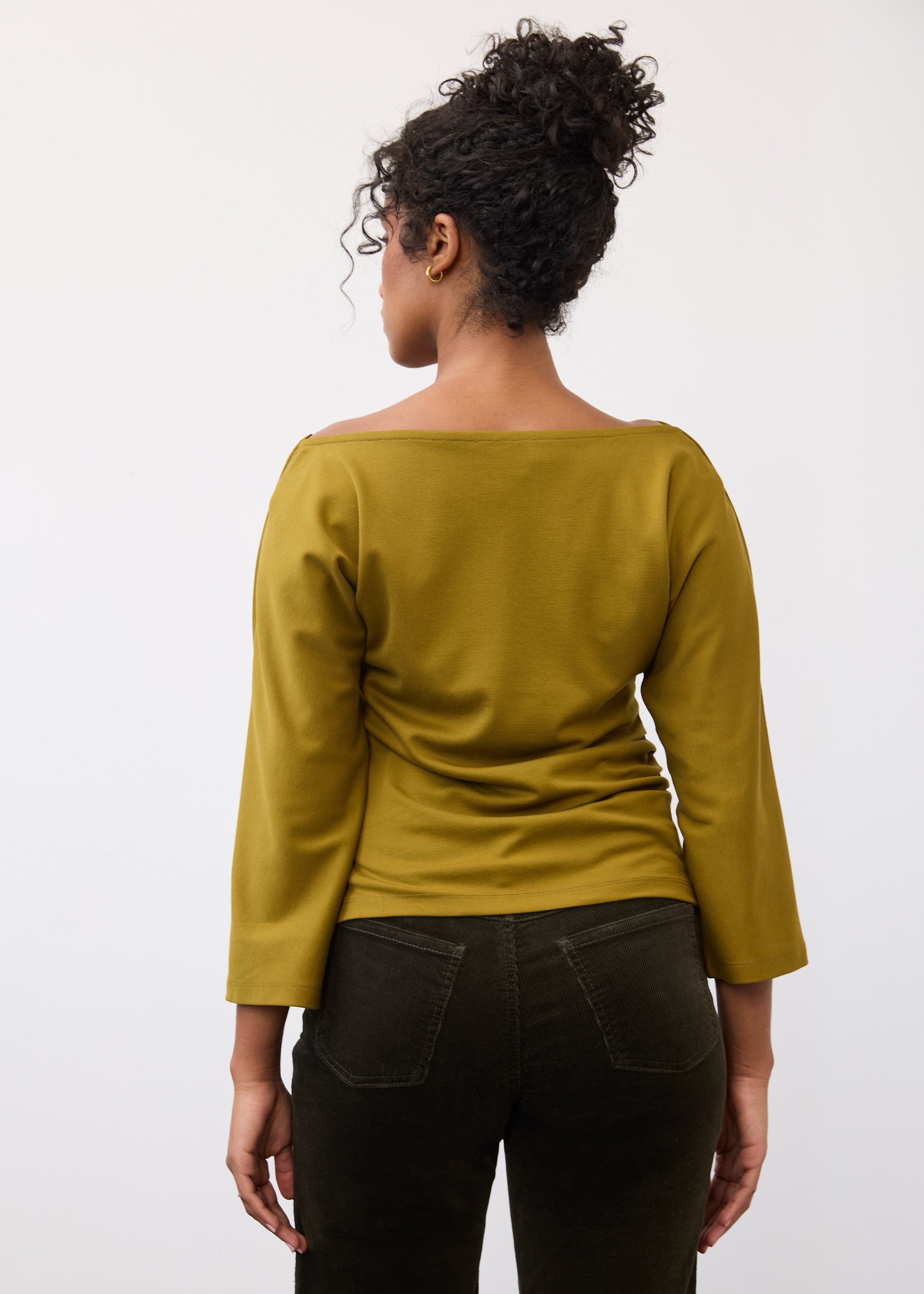 Back view of olive green top showing simple design and quarter sleeves by French Dressing Jeans (FDJ)