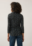 Back view of black polka dot top, highlighting the seamless design and fit by French Dressing Jeans (FDJ)