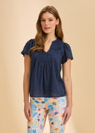 Front view of navy short-sleeve top with V-neck by French Dressing Jeans (FDJ)