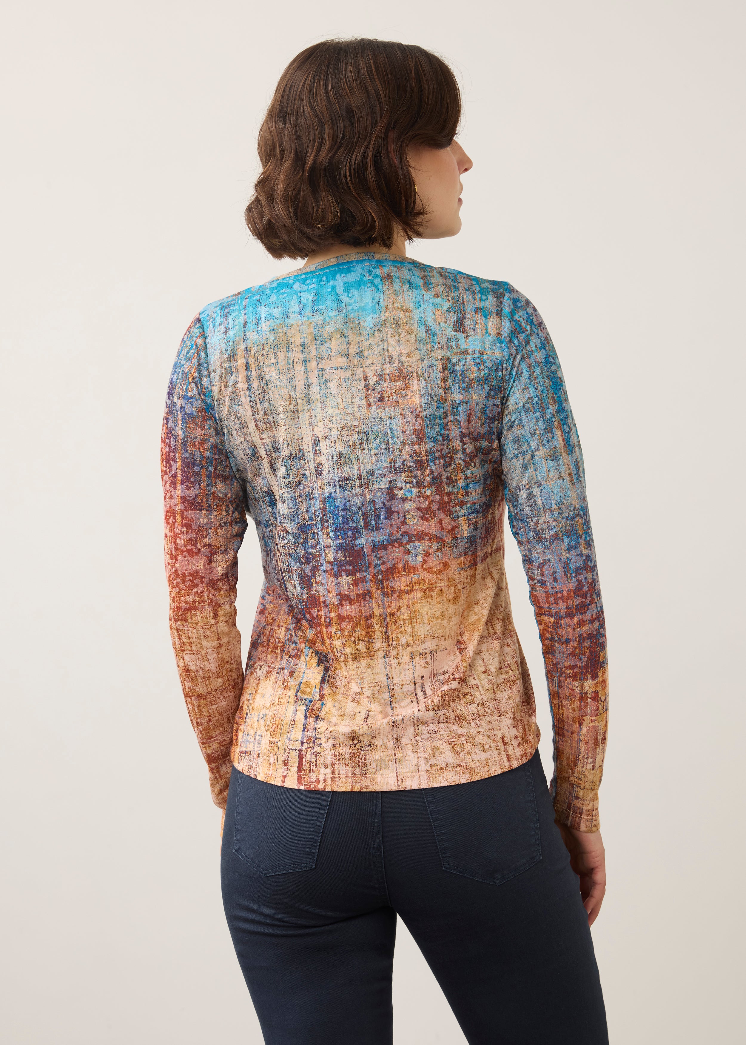 Back view of long sleeve top in colorful gradient pattern showing seamless fit by French Dressing Jeans (FDJ)