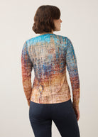 Back view of long sleeve top in colorful gradient pattern showing seamless fit by French Dressing Jeans (FDJ)