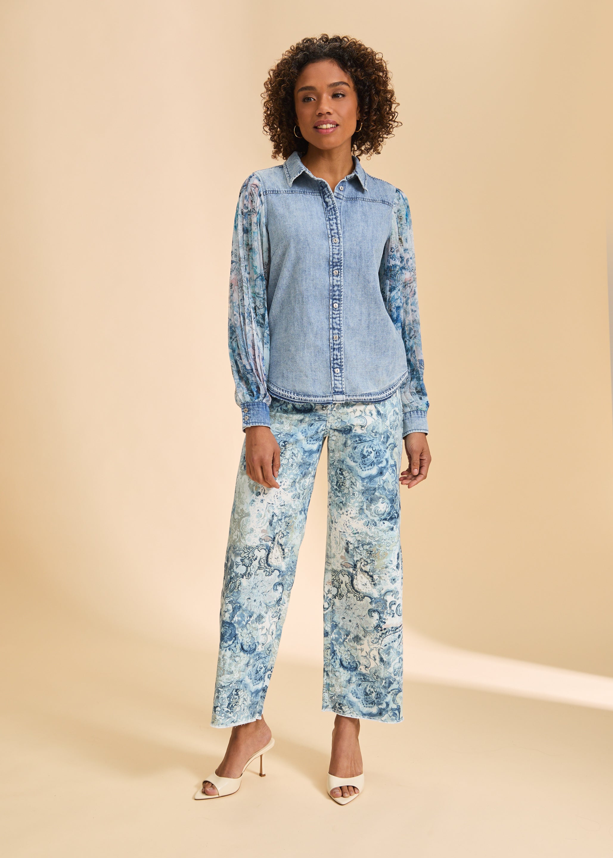 Full view of denim shirt with sheer sleeves paired with patterned pants by French Dressing Jeans (FDJ)
