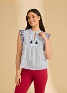 Front view of flutter sleeve top in Spritz Stripes showing V-neck and tassel details by French Dressing Jeans (FDJ)