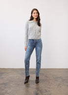Full body view of gray cabled cardigan paired with jeans and boots by French Dressing Jeans (FDJ)