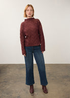 Model wearing burgundy patterned top with jeans, full outfit view by French Dressing Jeans (FDJ)