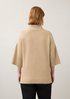 Back view of beige tunic sweater showing ribbed hem and sleeves by French Dressing Jeans (FDJ)