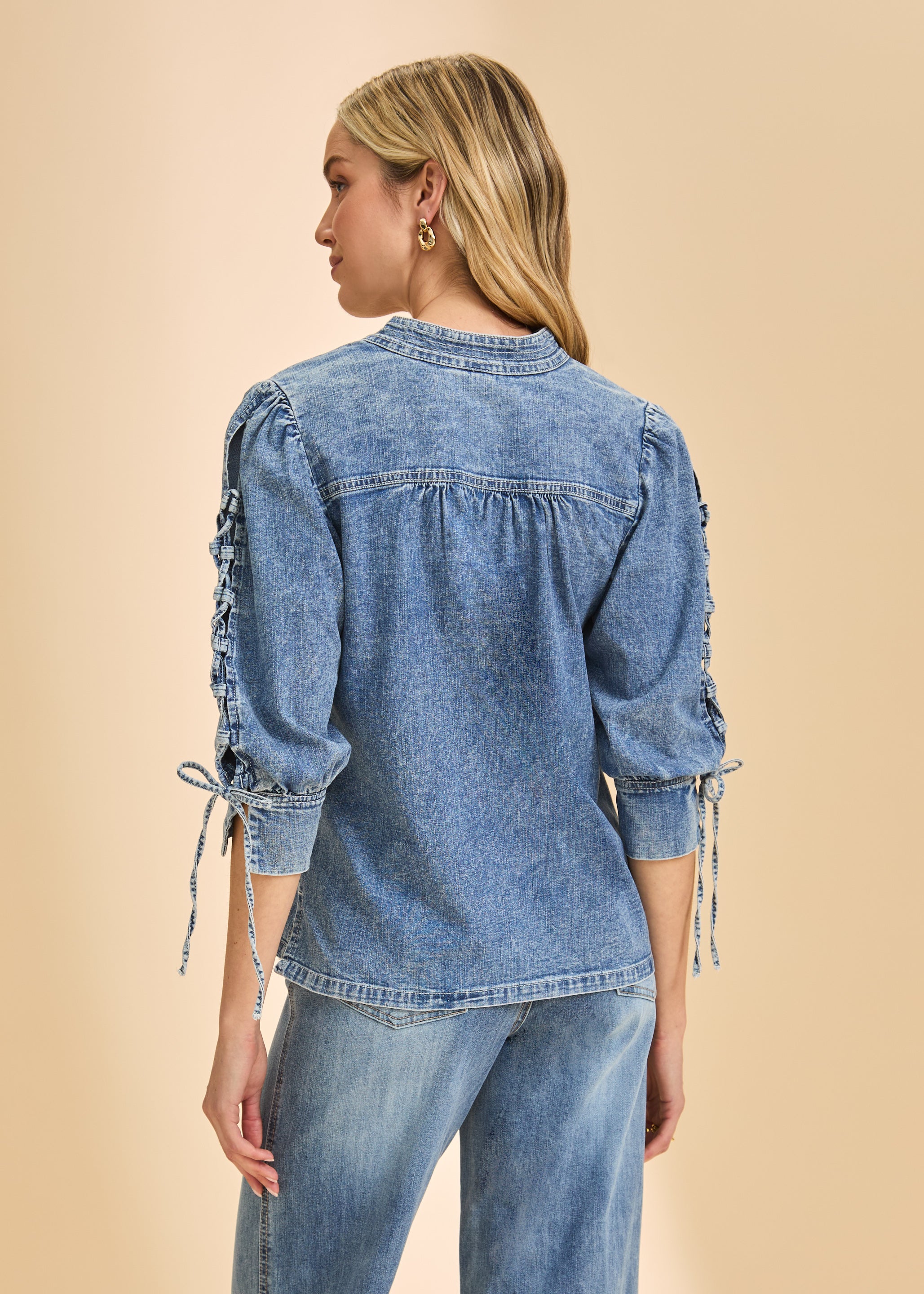 Back view of chambray shirt showcasing lace-up detail on sleeves by French Dressing Jeans (FDJ)