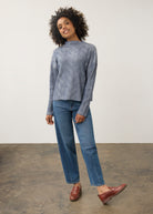 Model in blue textured top paired with jeans, full outfit view by French Dressing Jeans (FDJ)