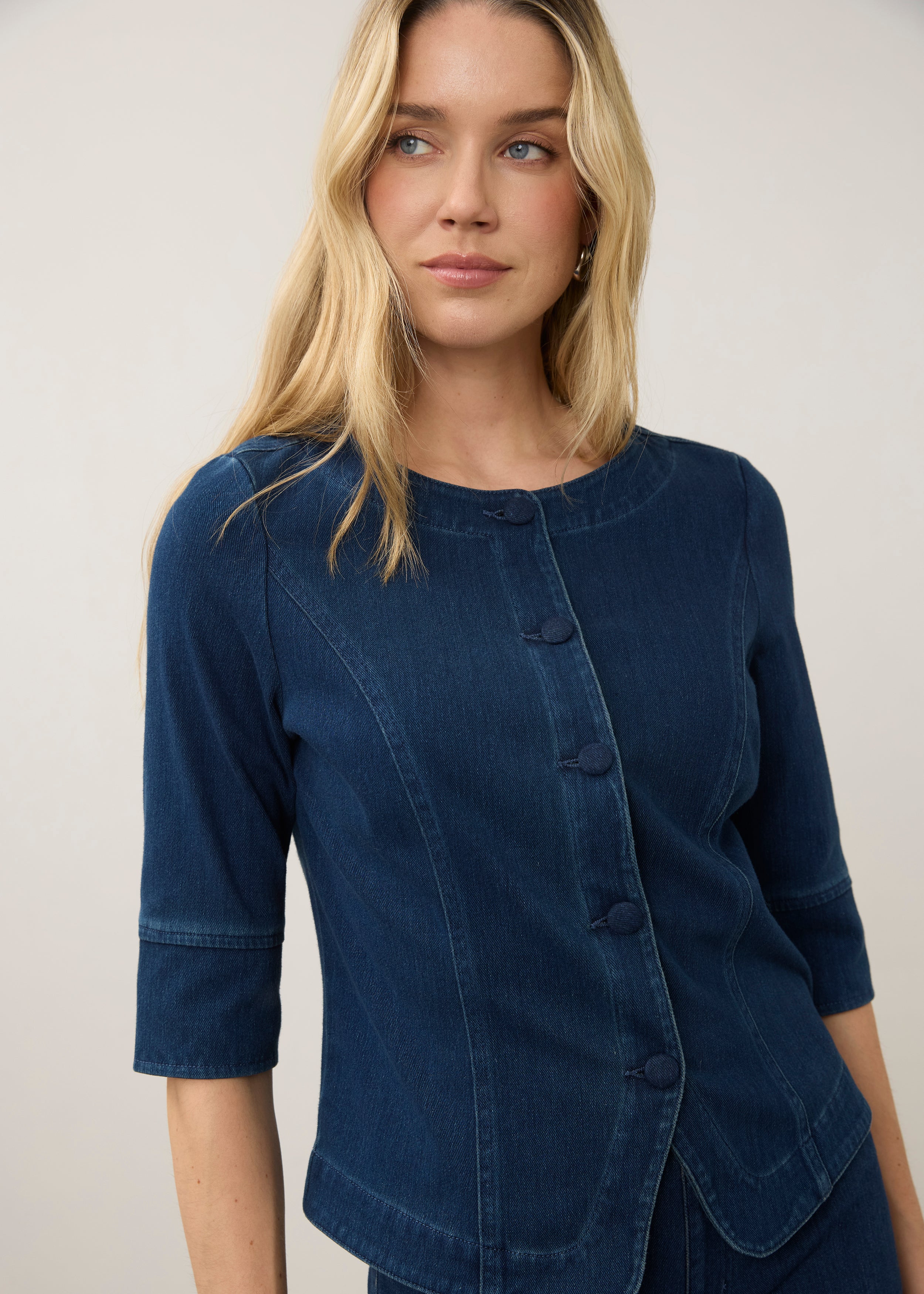 Detail shot of dark rinse button-up top with focus on front buttons and stitching by French Dressing Jeans (FDJ)