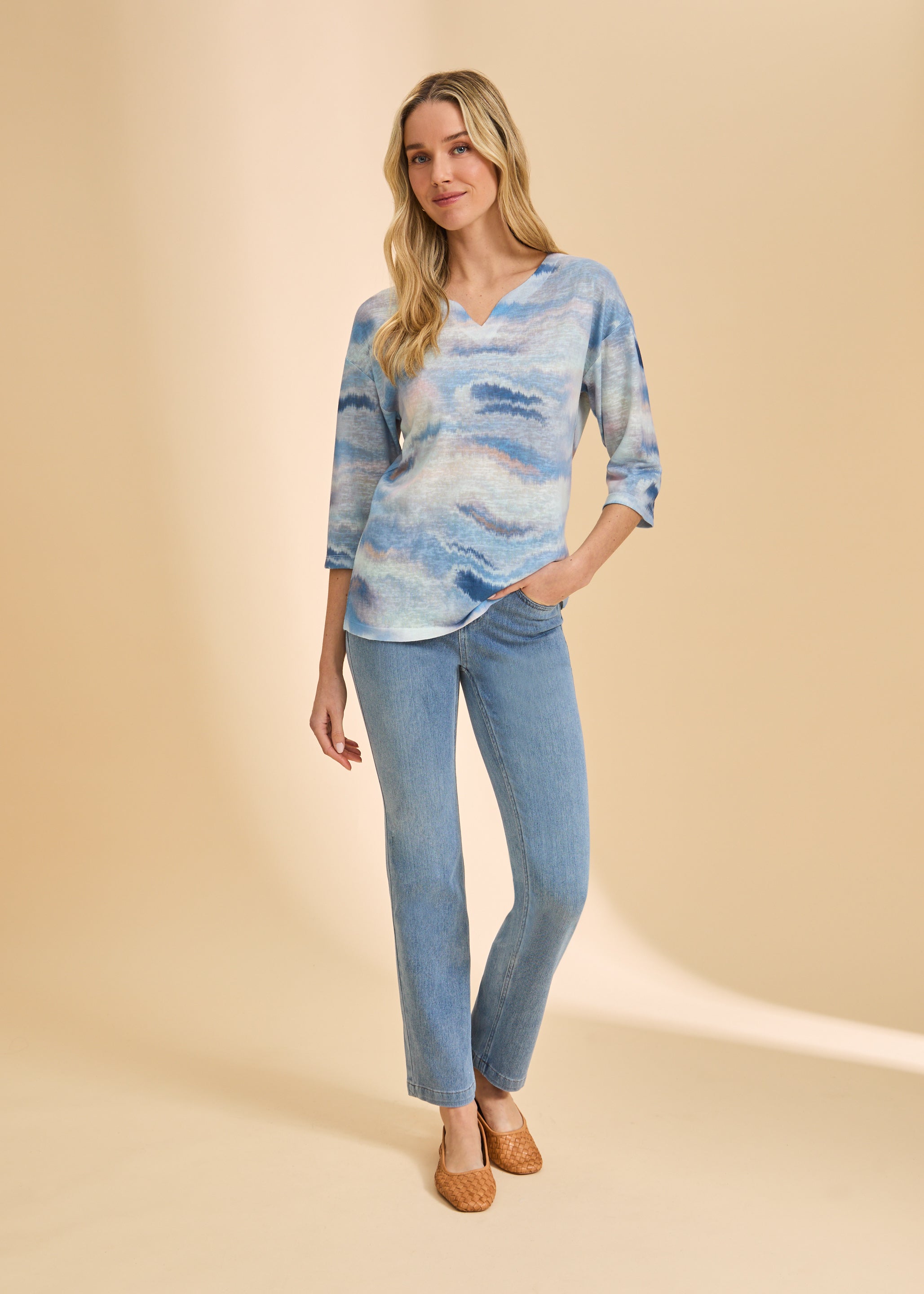 Full-body view of blue wave print top and denim jeans combination by French Dressing Jeans (FDJ)