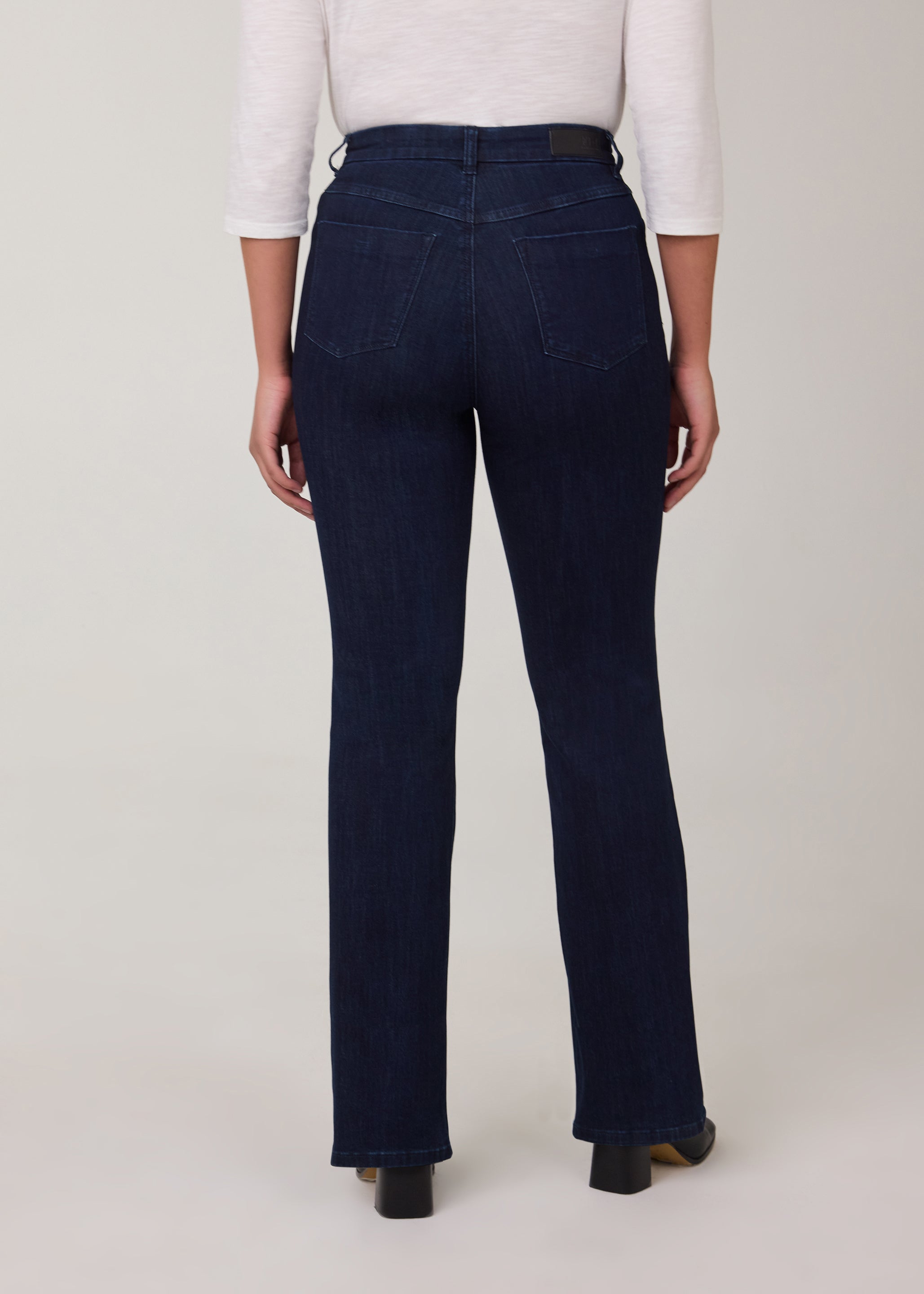 Back view of straight leg jeans in vibrant Delight color with pockets by French Dressing Jeans (FDJ)
