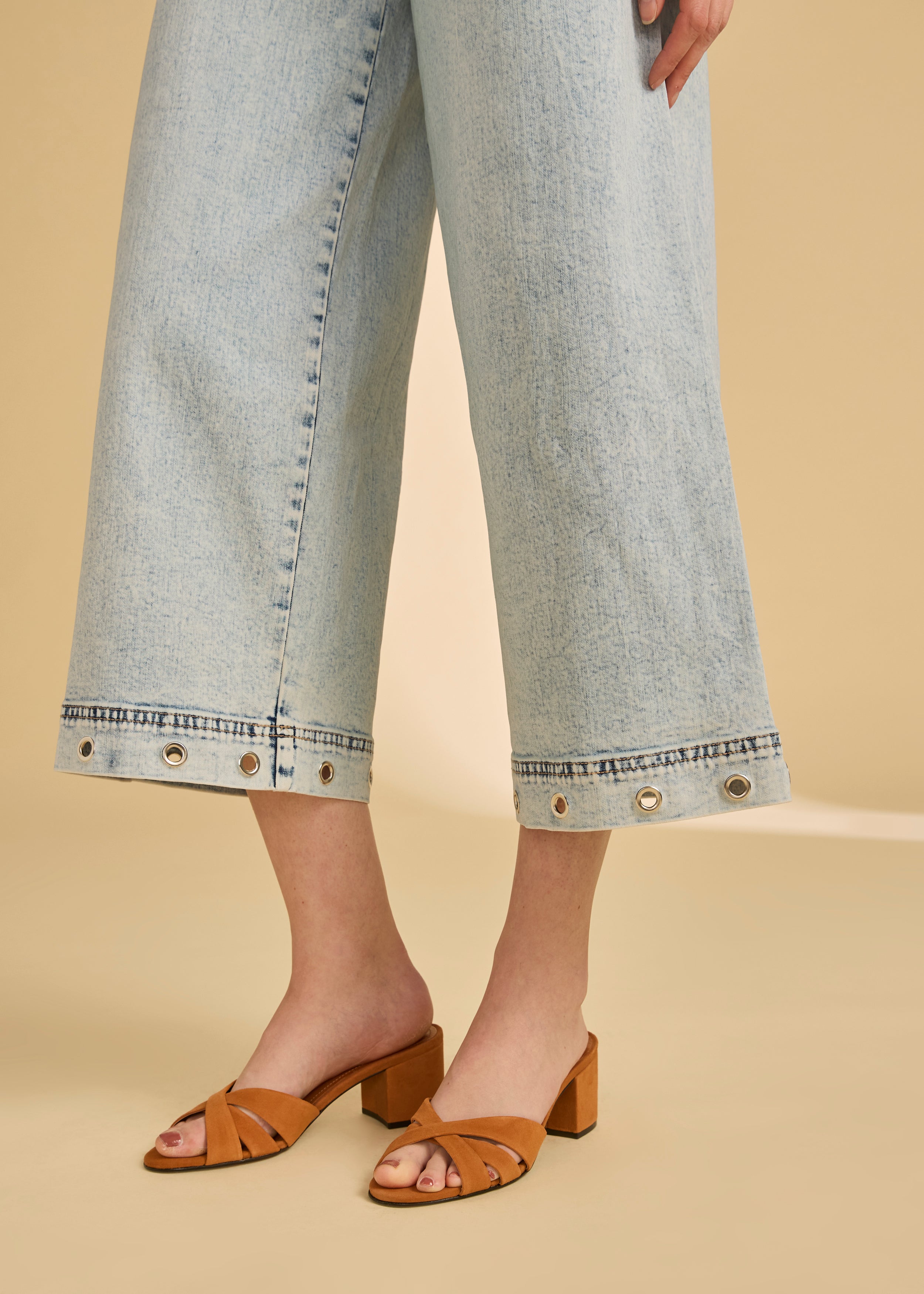 Side detail of ocean denim wide crop jeans with eyelet accents by French Dressing Jeans (FDJ)