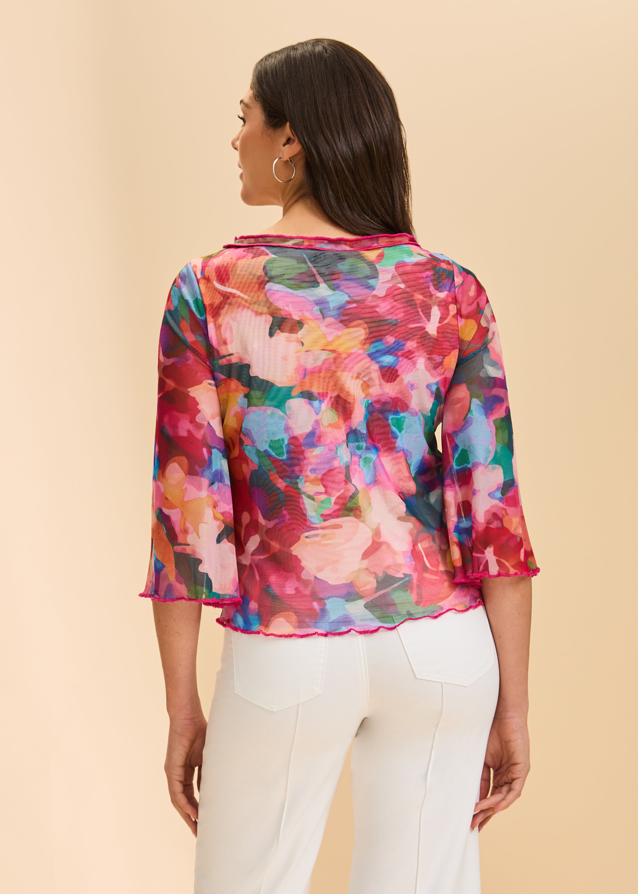 Back view of colorful sheer top displaying vibrant floral pattern by French Dressing Jeans (FDJ)