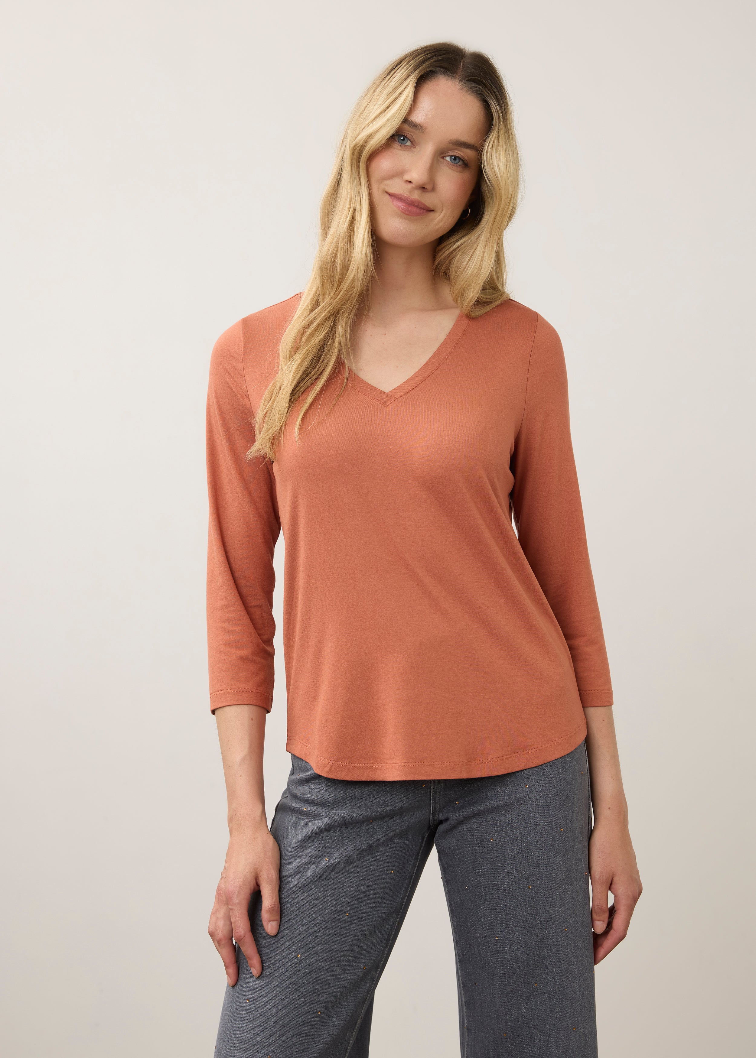 Front view of orange 3/4 sleeve V-neck top with warm tones and relaxed fit by French Dressing Jeans (FDJ)