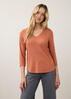 Front view of orange 3/4 sleeve V-neck top with warm tones and relaxed fit by French Dressing Jeans (FDJ)