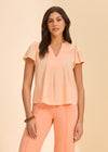 Front view of peach short-sleeve top with V-neck by French Dressing Jeans (FDJ)