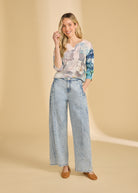 Model wearing powder wash wide leg jeans with high-rise fit showcasing full outfit by French Dressing Jeans (FDJ)