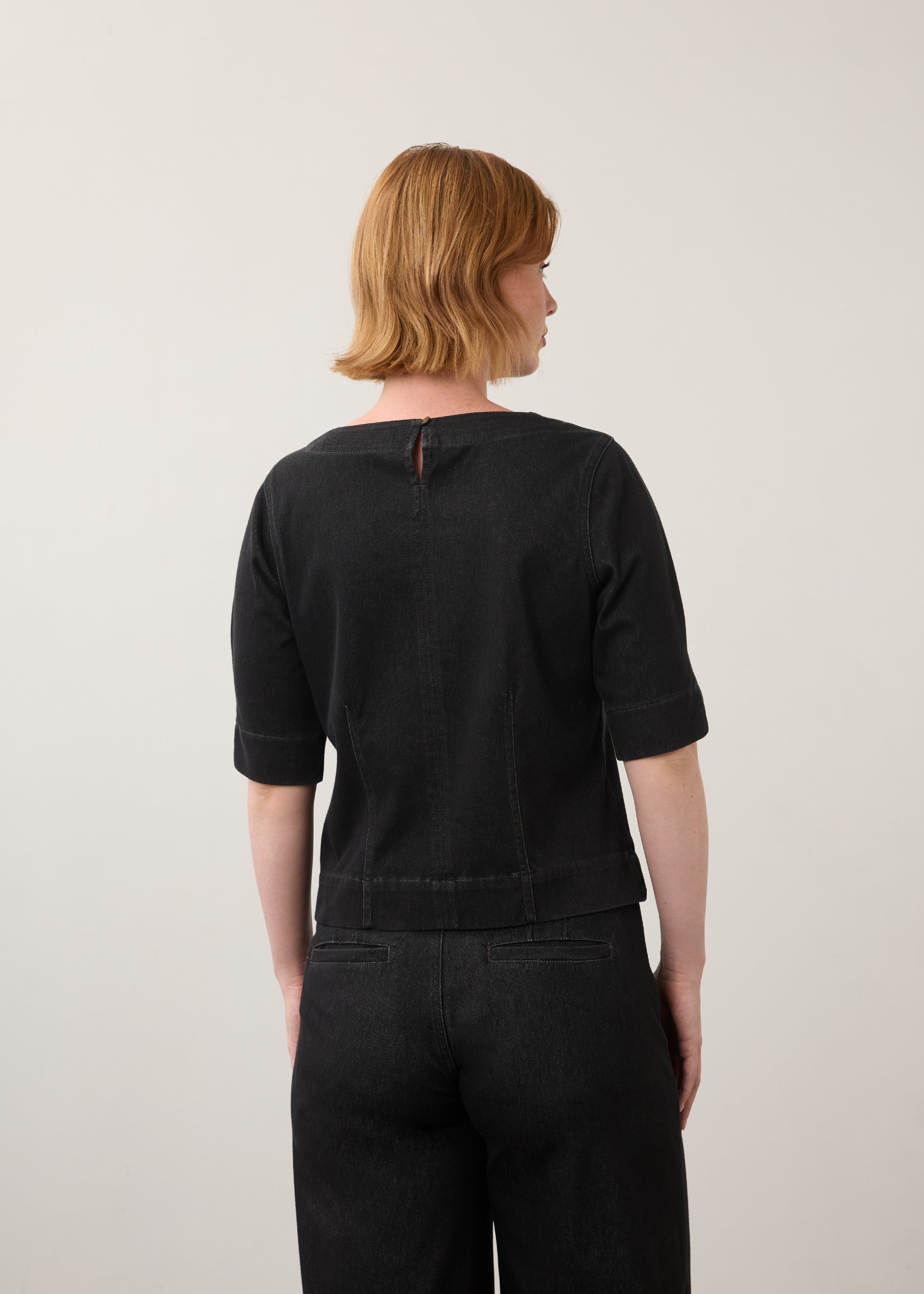 Back view of black fitted top showing keyhole detail and seam stitching by French Dressing Jeans (FDJ)
