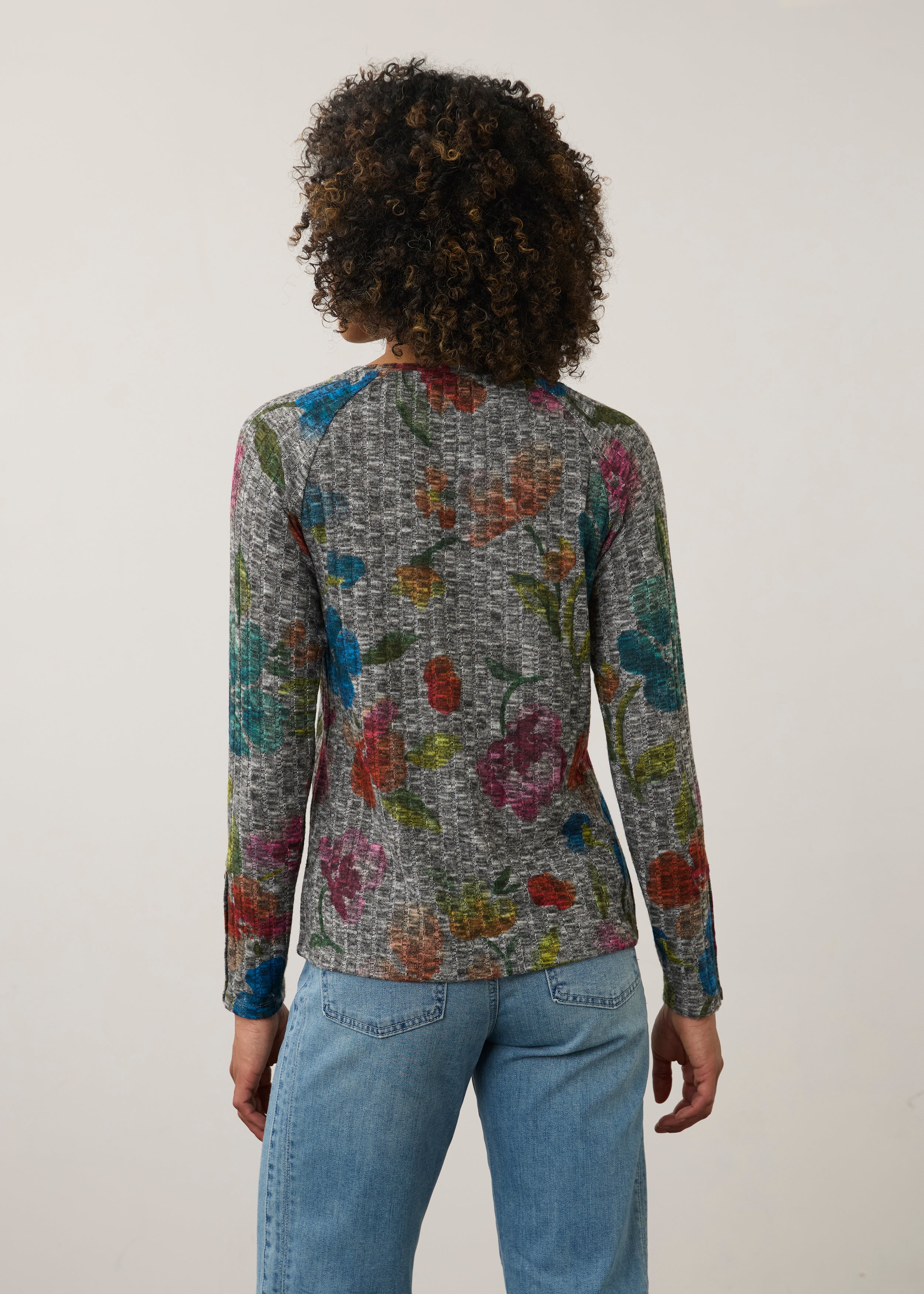 Back view of colorful floral top, highlighting vibrant pattern and seamless design by French Dressing Jeans (FDJ)