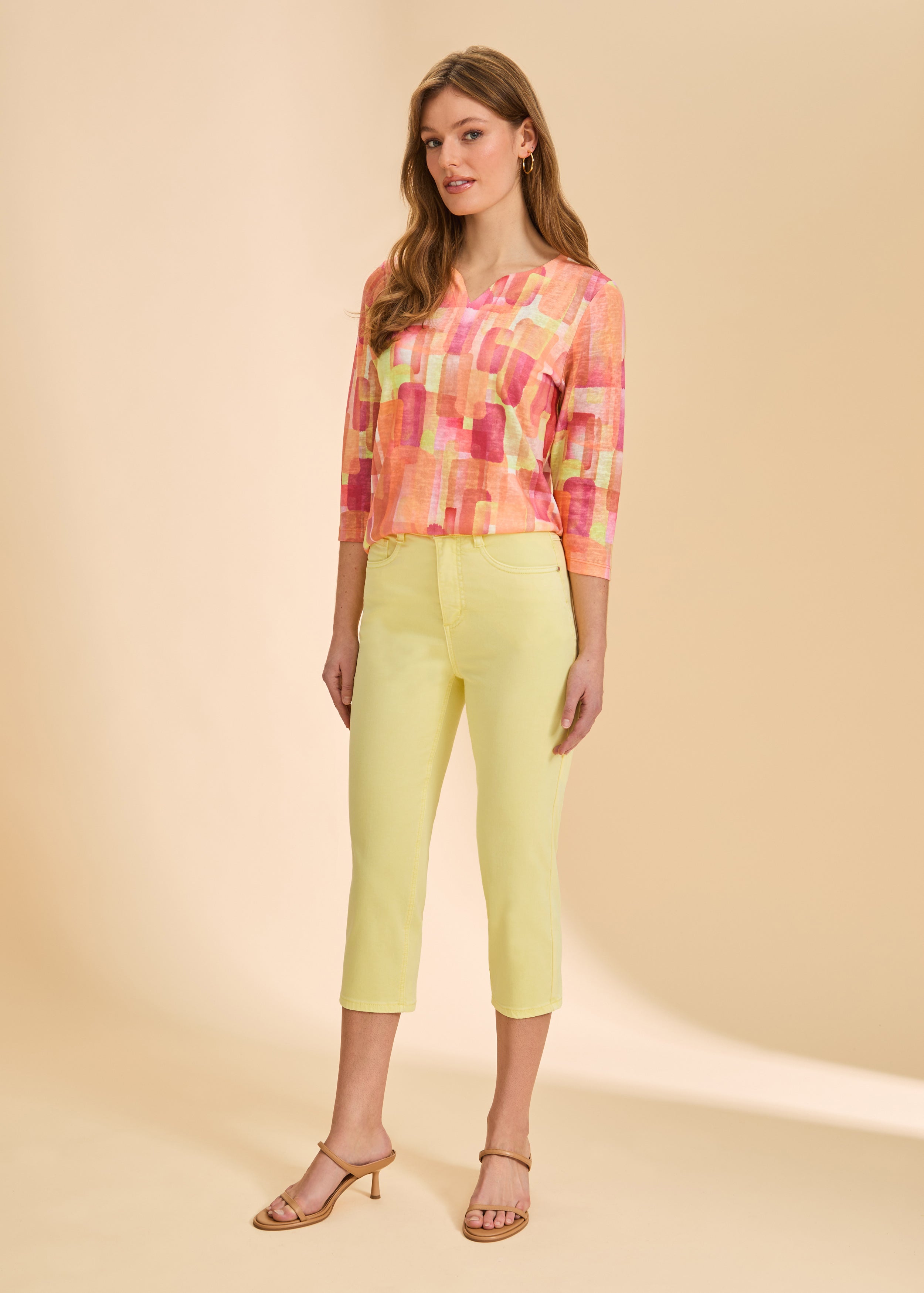 Front view of yellow cropped jeans, styled with colorful top by French Dressing Jeans (FDJ)